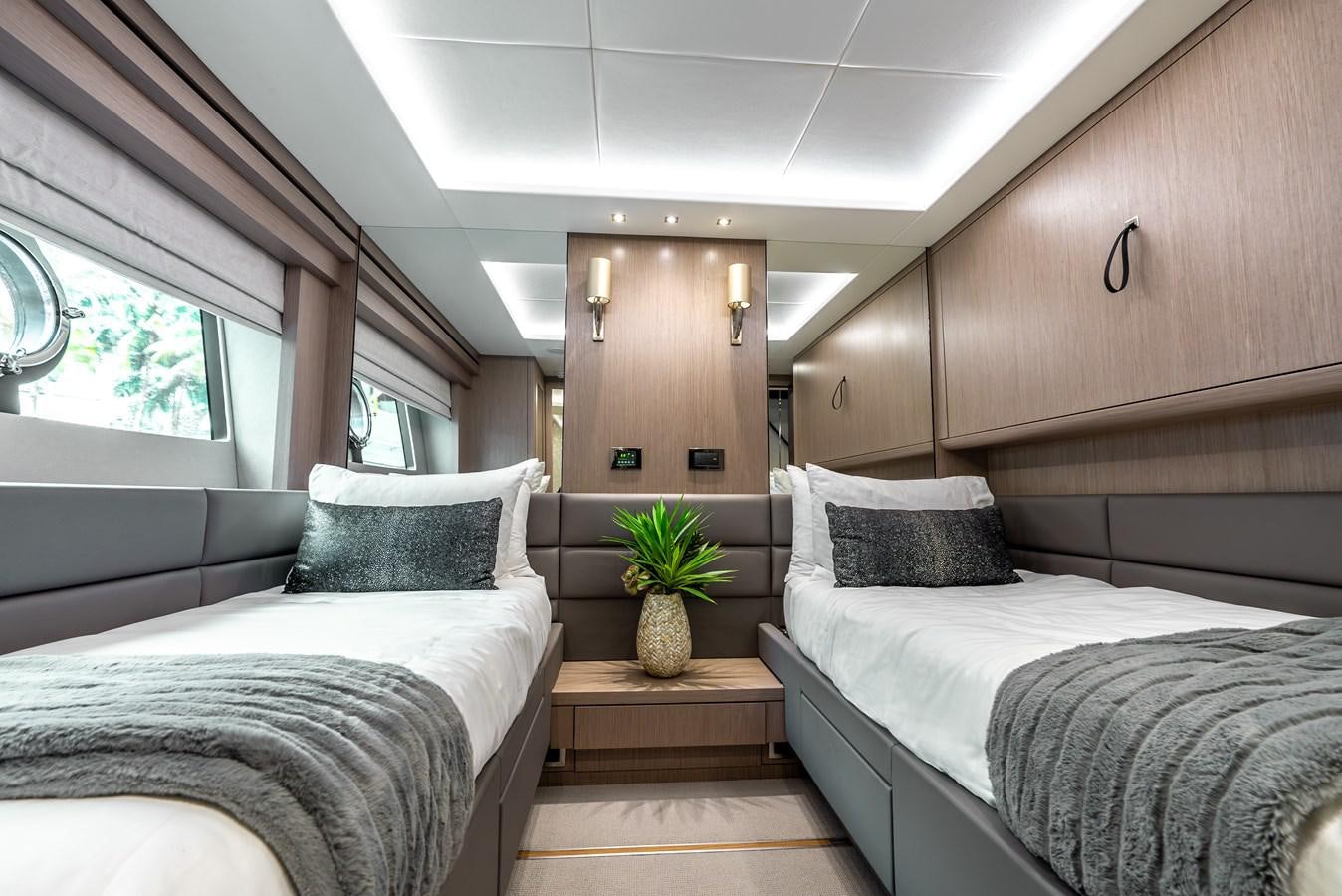 a couple of beds in a room aboard F5 Yacht for Sale