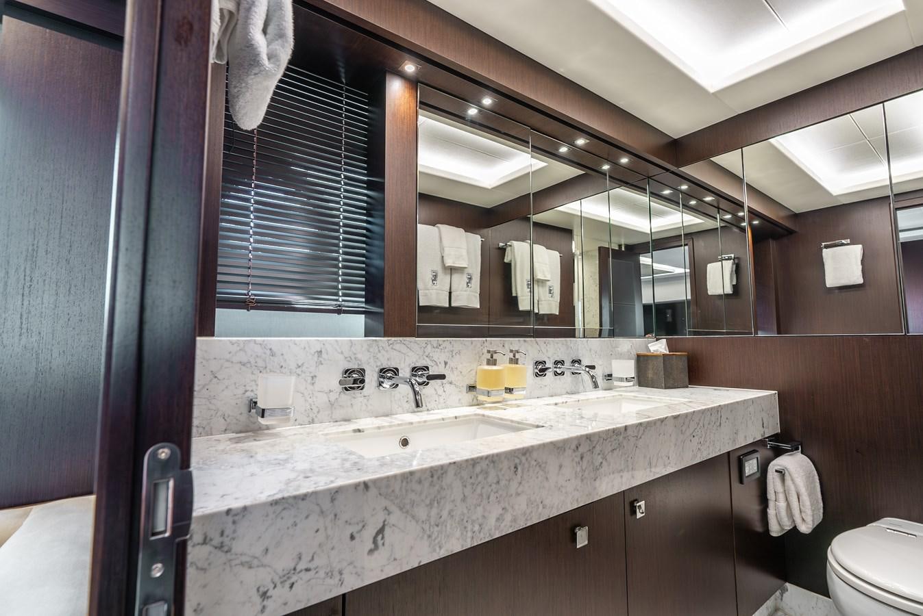 a bathroom with a sink and a mirror aboard F5 Yacht for Sale