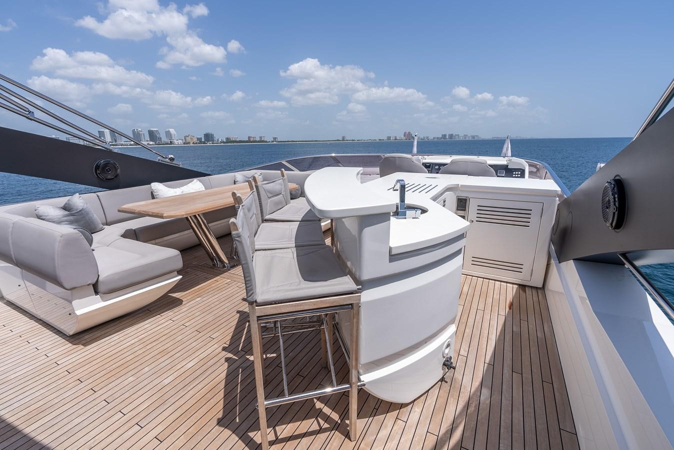 a deck with chairs on it aboard F5 Yacht for Sale