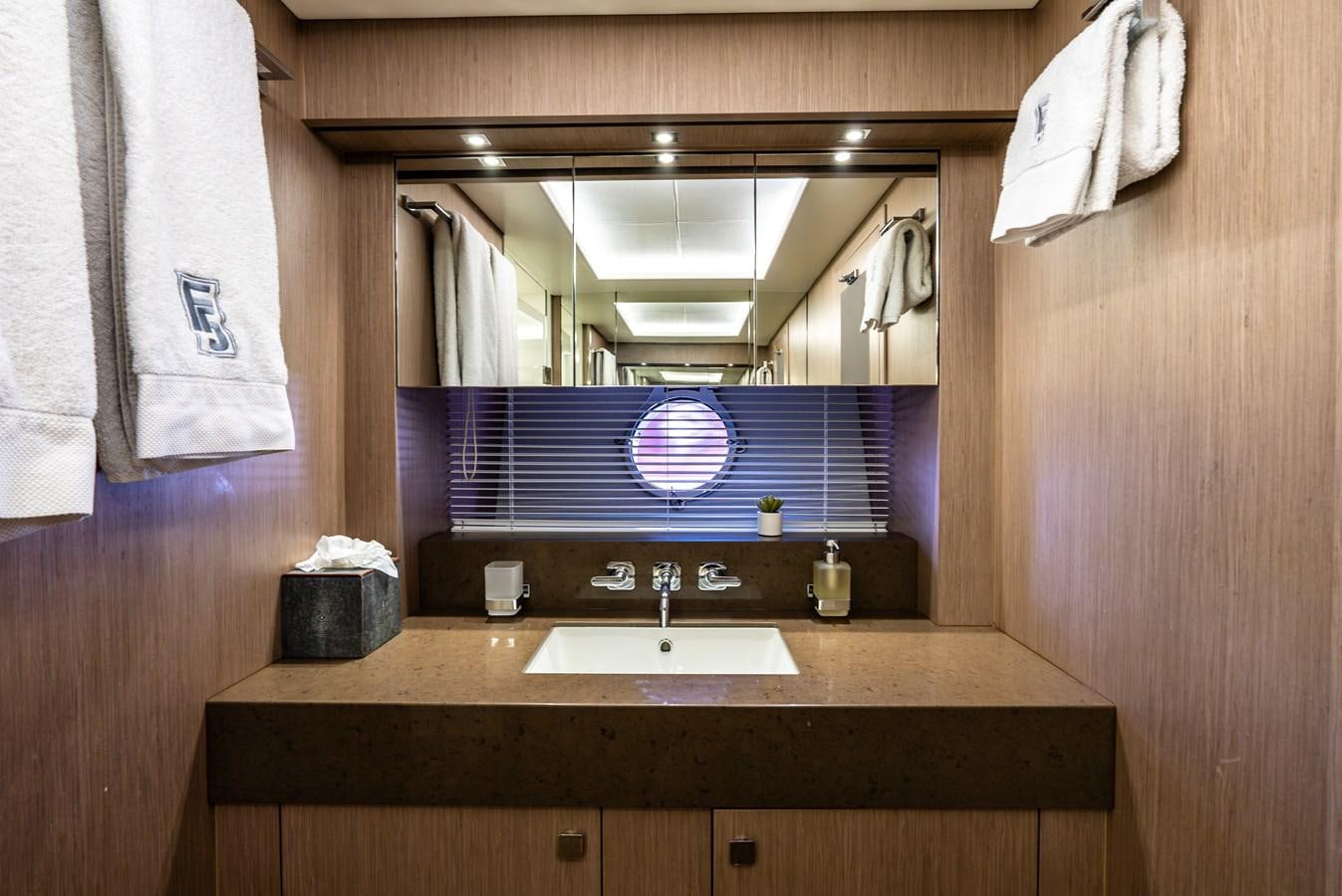 a bathroom with a sink and a mirror aboard F5 Yacht for Sale
