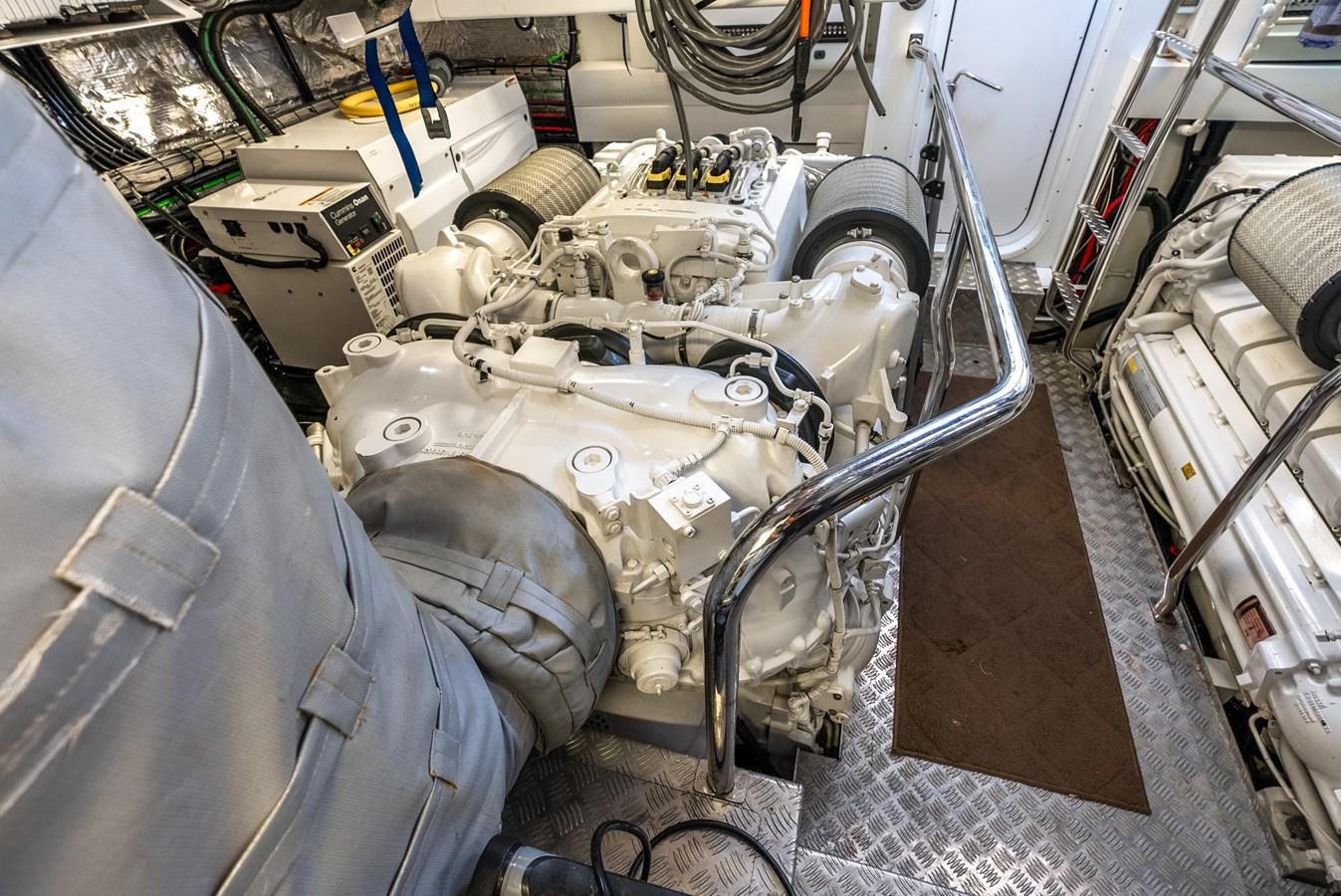a car with a large engine aboard F5 Yacht for Sale