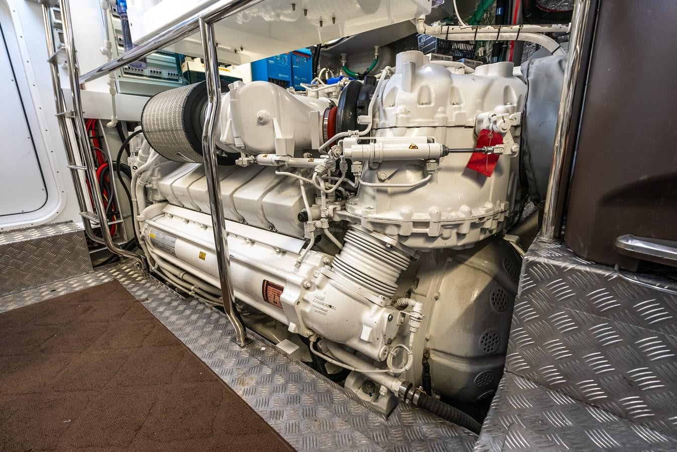 a car with a large engine aboard F5 Yacht for Sale