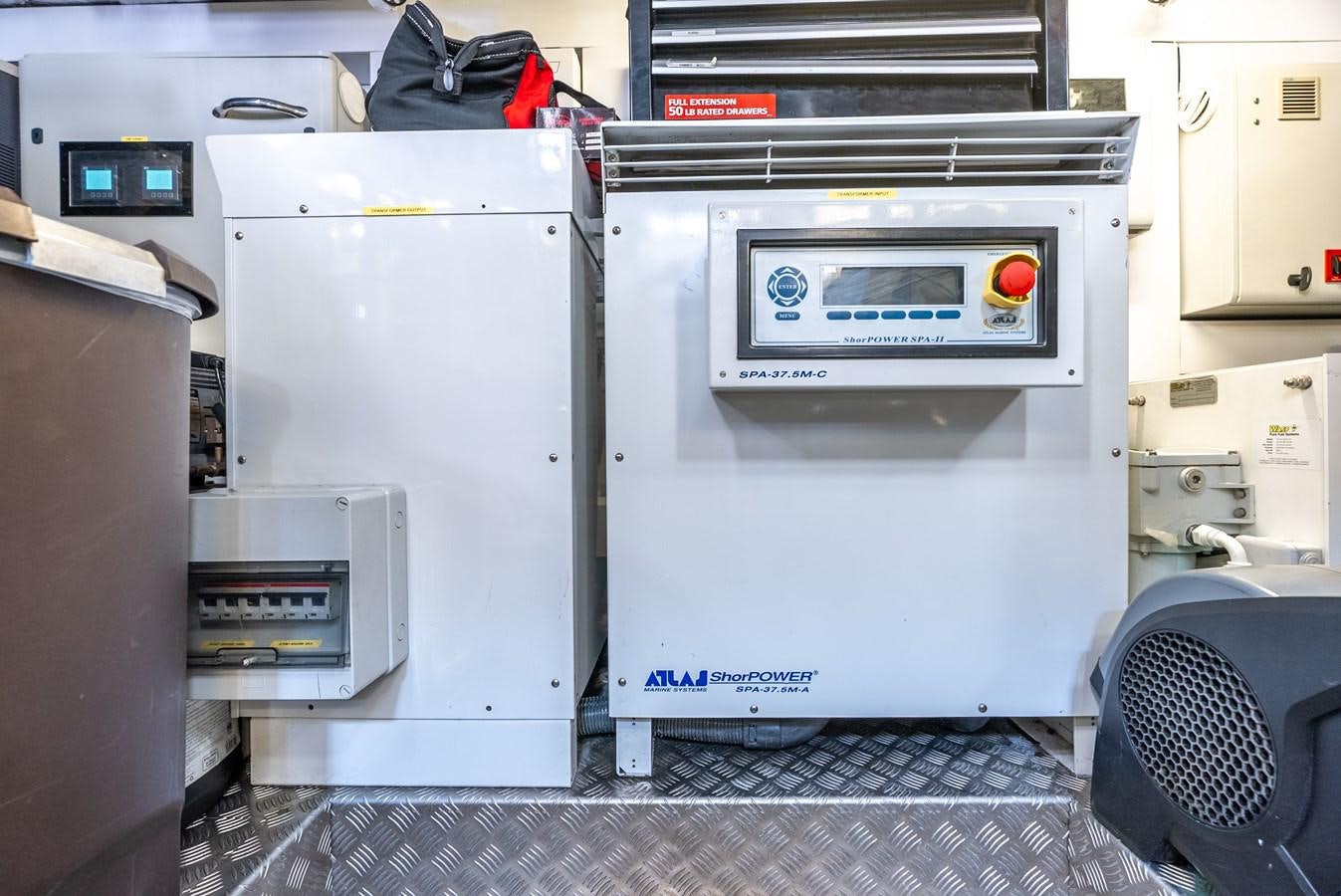 a white refrigerator in a kitchen aboard F5 Yacht for Sale