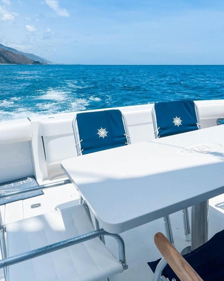 a boat on the water aboard BERTRAM 66 Yacht for Sale