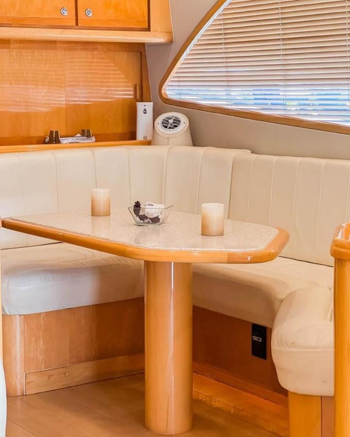 a table with cups on it aboard BERTRAM 66 Yacht for Sale