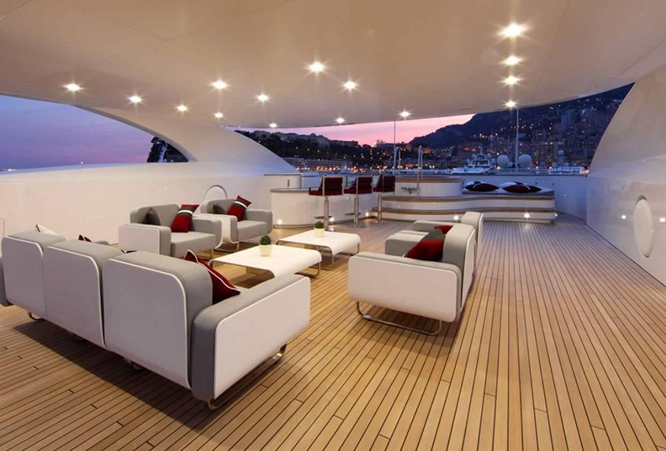 a large room with a couch and a table aboard ARMADA Yacht for Sale