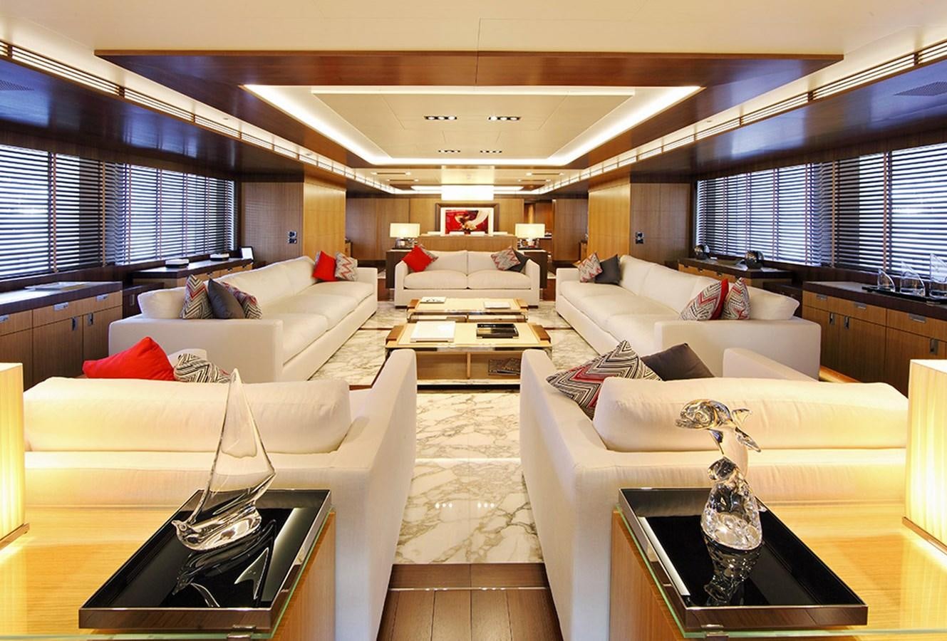a living room with white couches aboard ARMADA Yacht for Sale