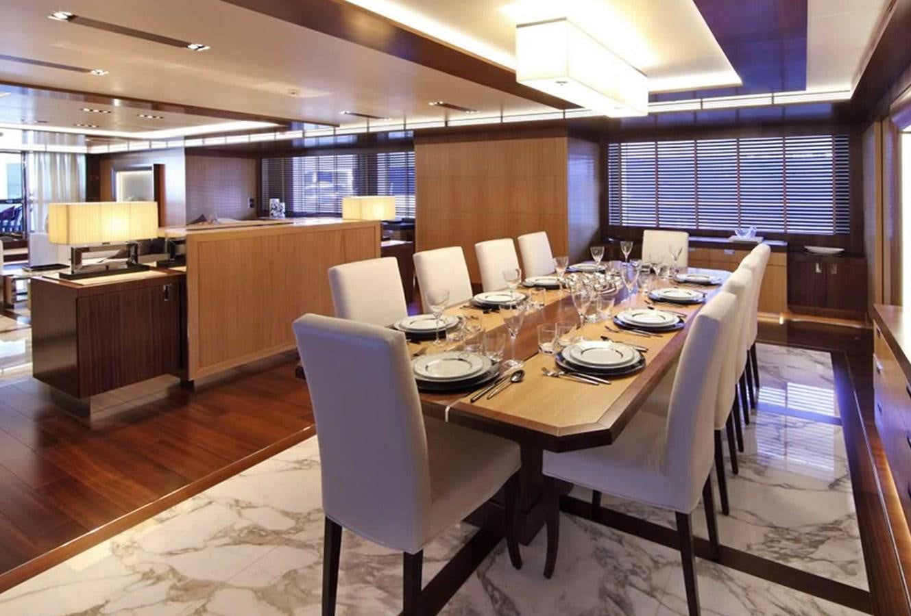 a large room with tables and chairs aboard ARMADA Yacht for Sale