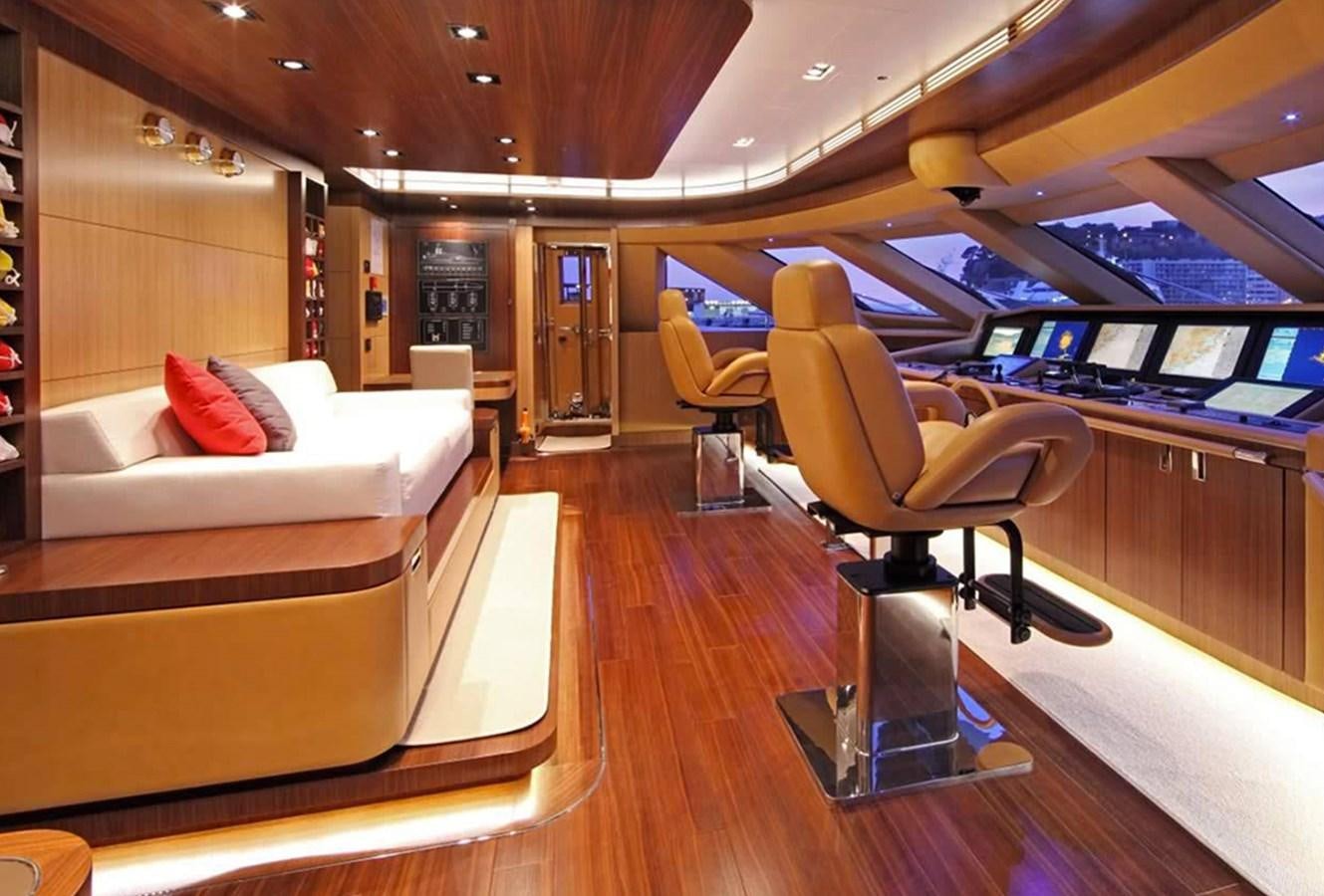a room with a bed and a chair aboard ARMADA Yacht for Sale