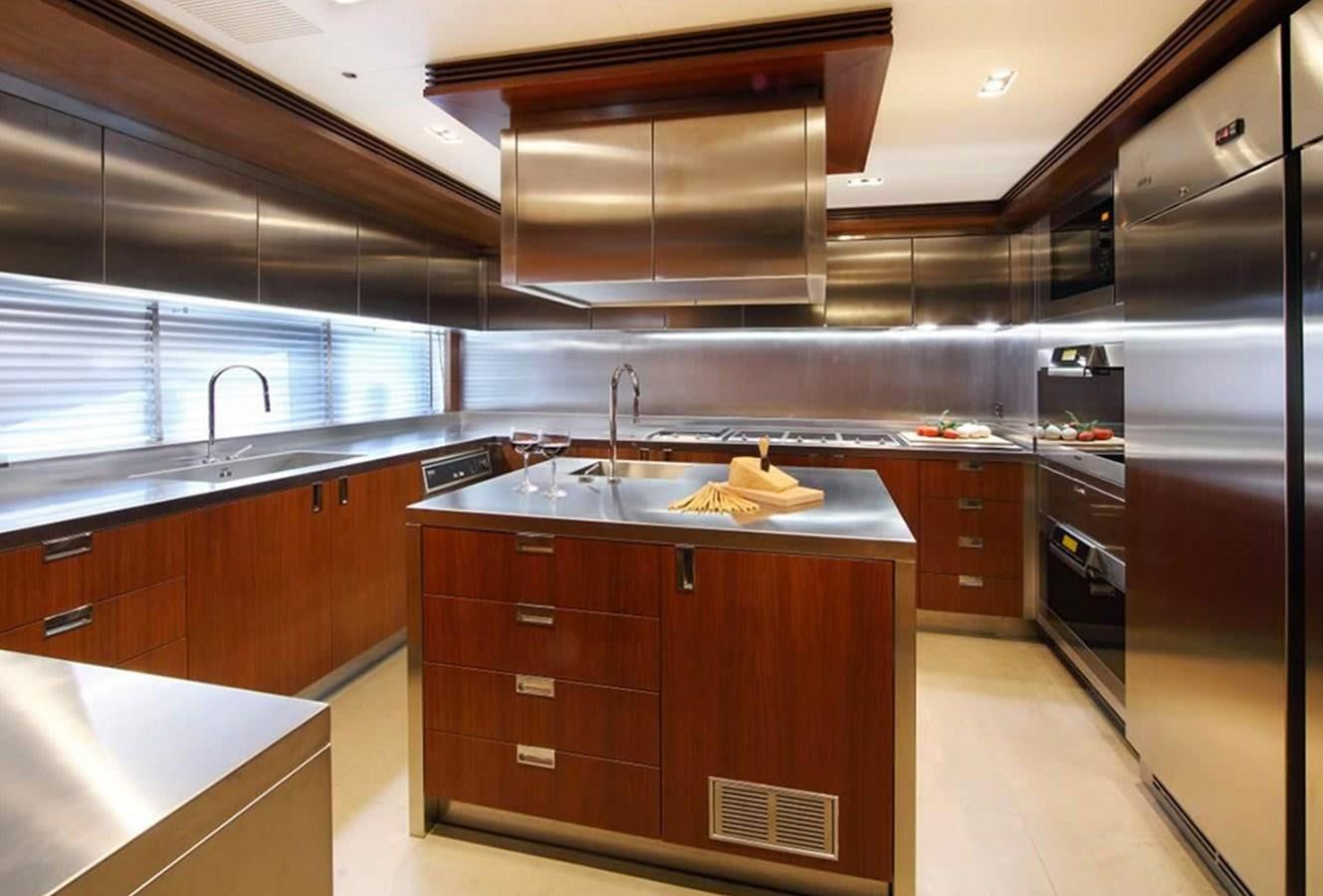 a kitchen with a large refrigerator aboard ARMADA Yacht for Sale
