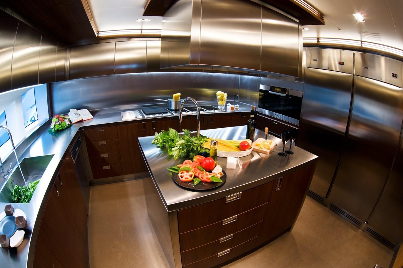 a kitchen with a large island aboard ARMADA Yacht for Sale
