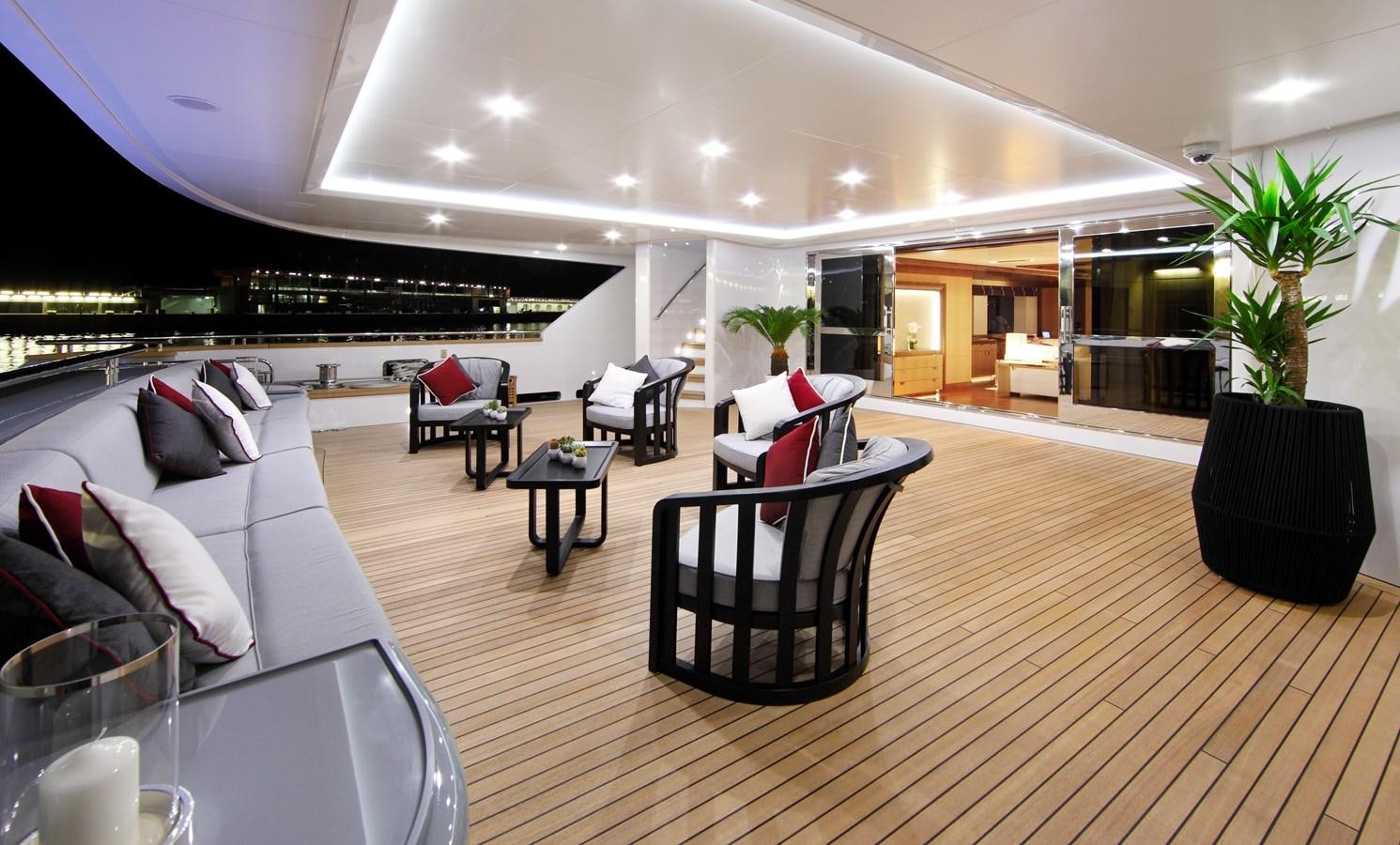 a large living room with a large balcony aboard ARMADA Yacht for Sale