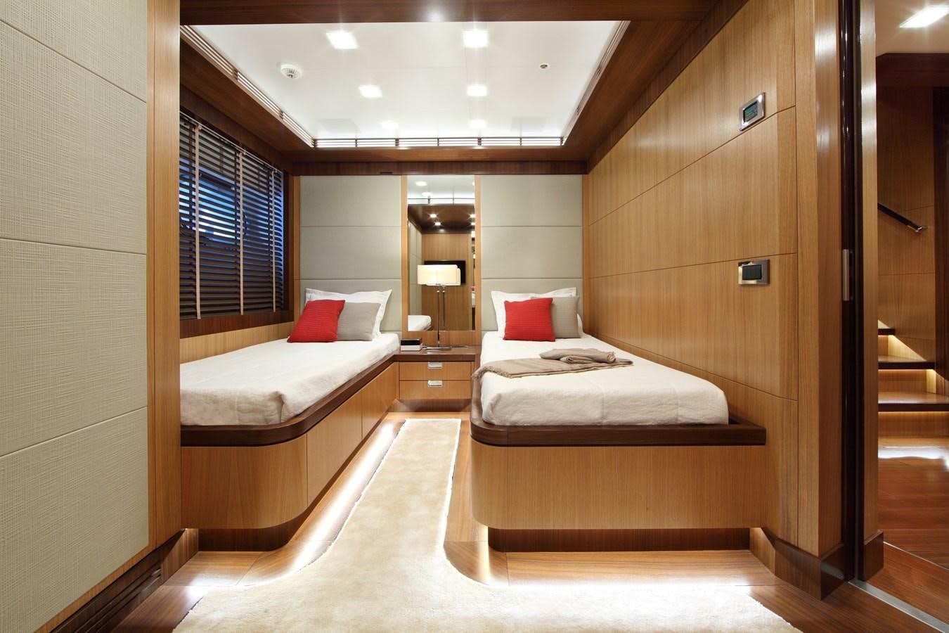 a room with a bed and a mirror aboard ARMADA Yacht for Sale