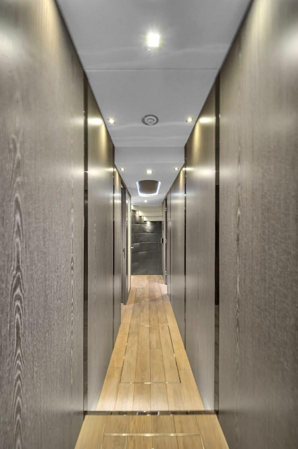 a hallway with a light on the ceiling aboard SUNSEEKER 115 SPORT YACHT  Yacht for Sale