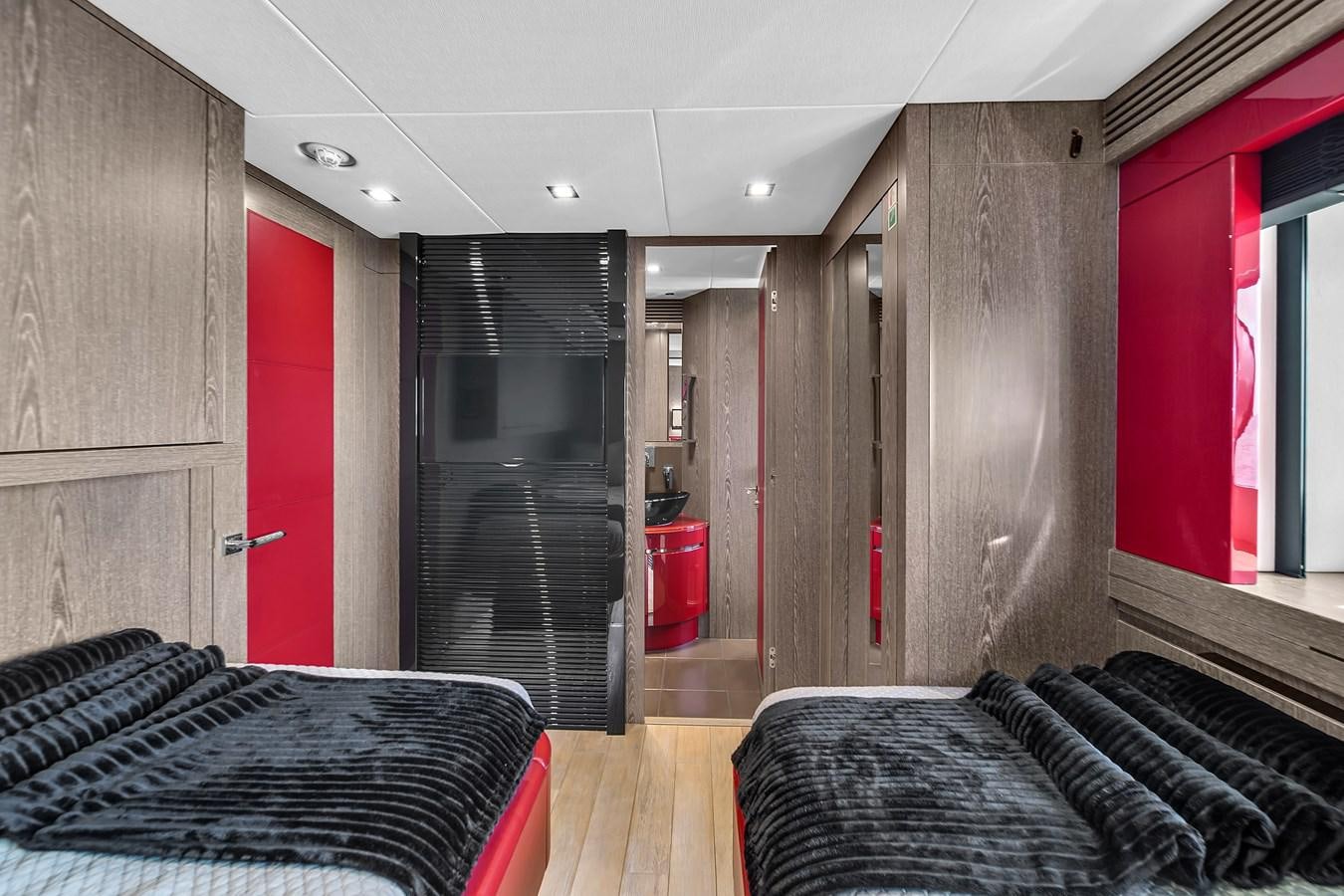 a room with a bed and a door aboard SUNSEEKER 115 SPORT YACHT  Yacht for Sale