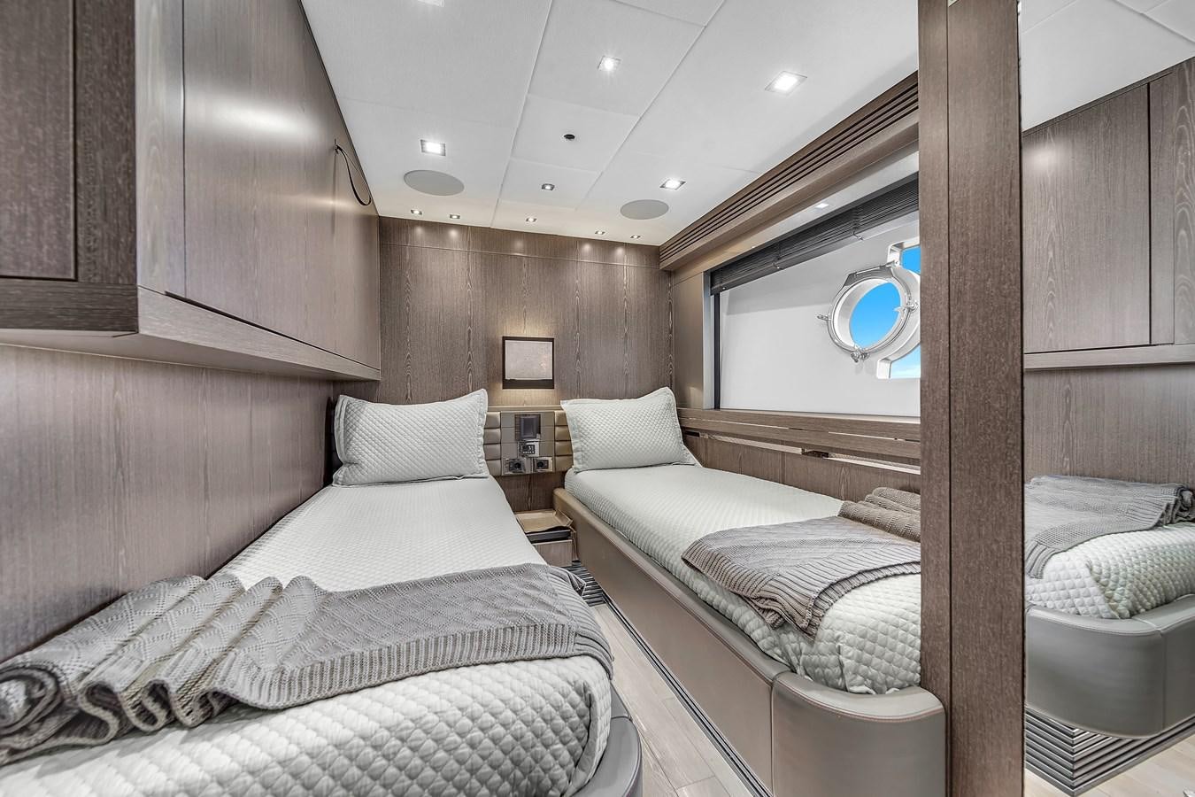 a room with two beds aboard SUNSEEKER 115 SPORT YACHT  Yacht for Sale