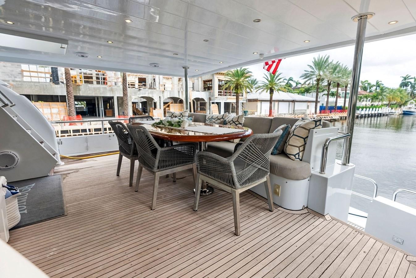 a table and chairs on a deck aboard TORTUGA Yacht for Sale