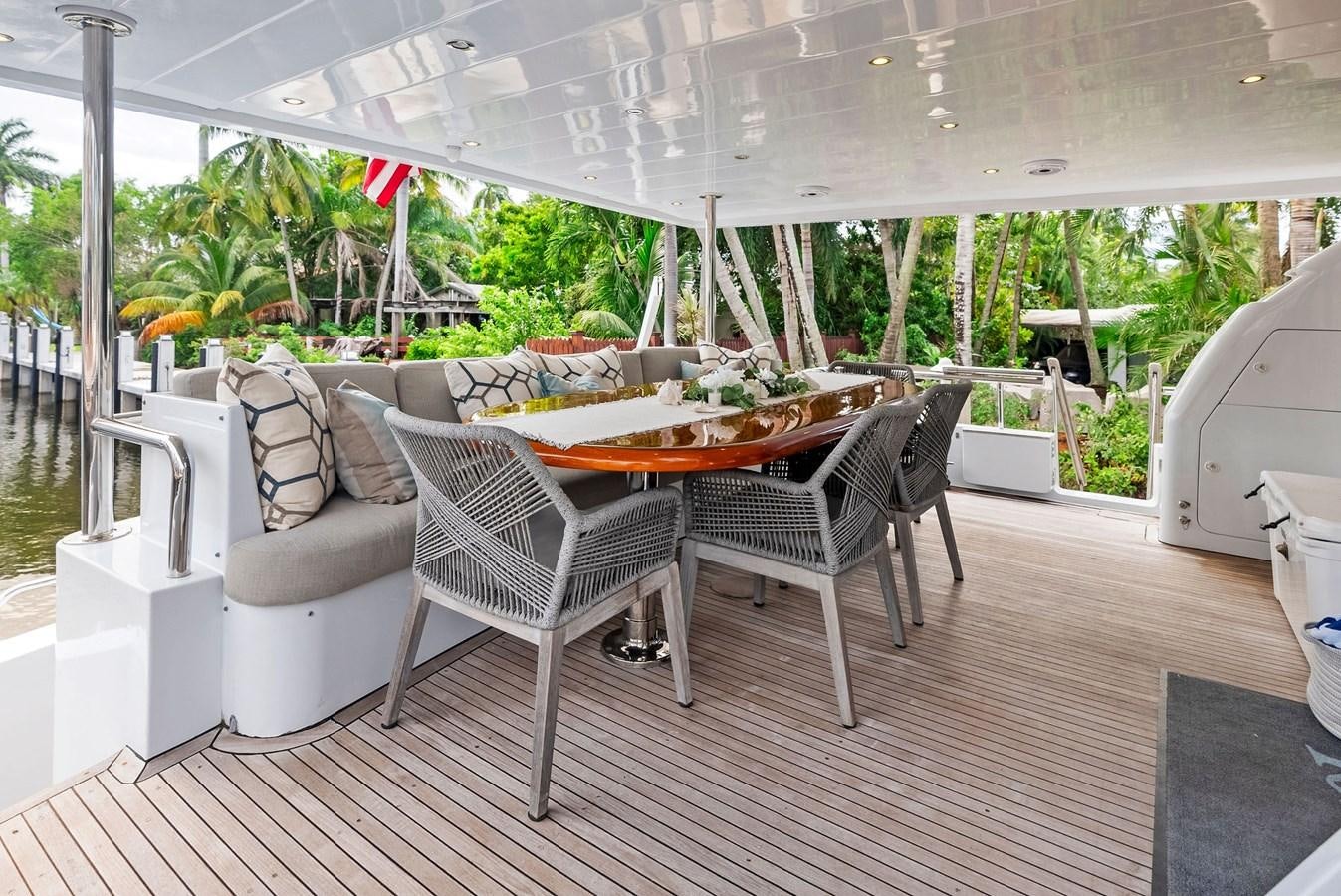 a patio with chairs and a table aboard TORTUGA Yacht for Sale