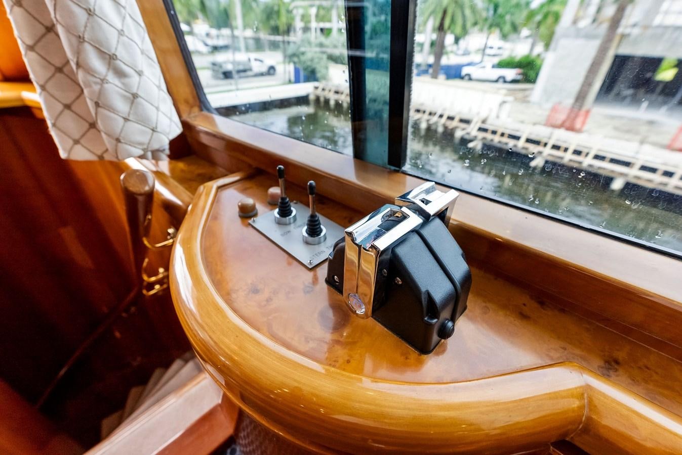 a device on a table aboard TORTUGA Yacht for Sale