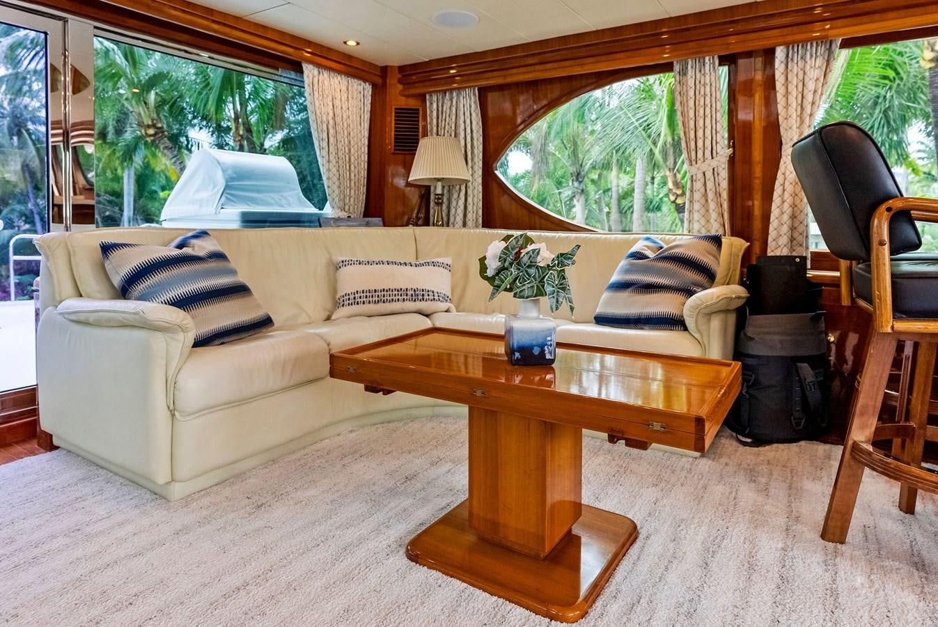 a living room with a couch and coffee table aboard TORTUGA Yacht for Sale