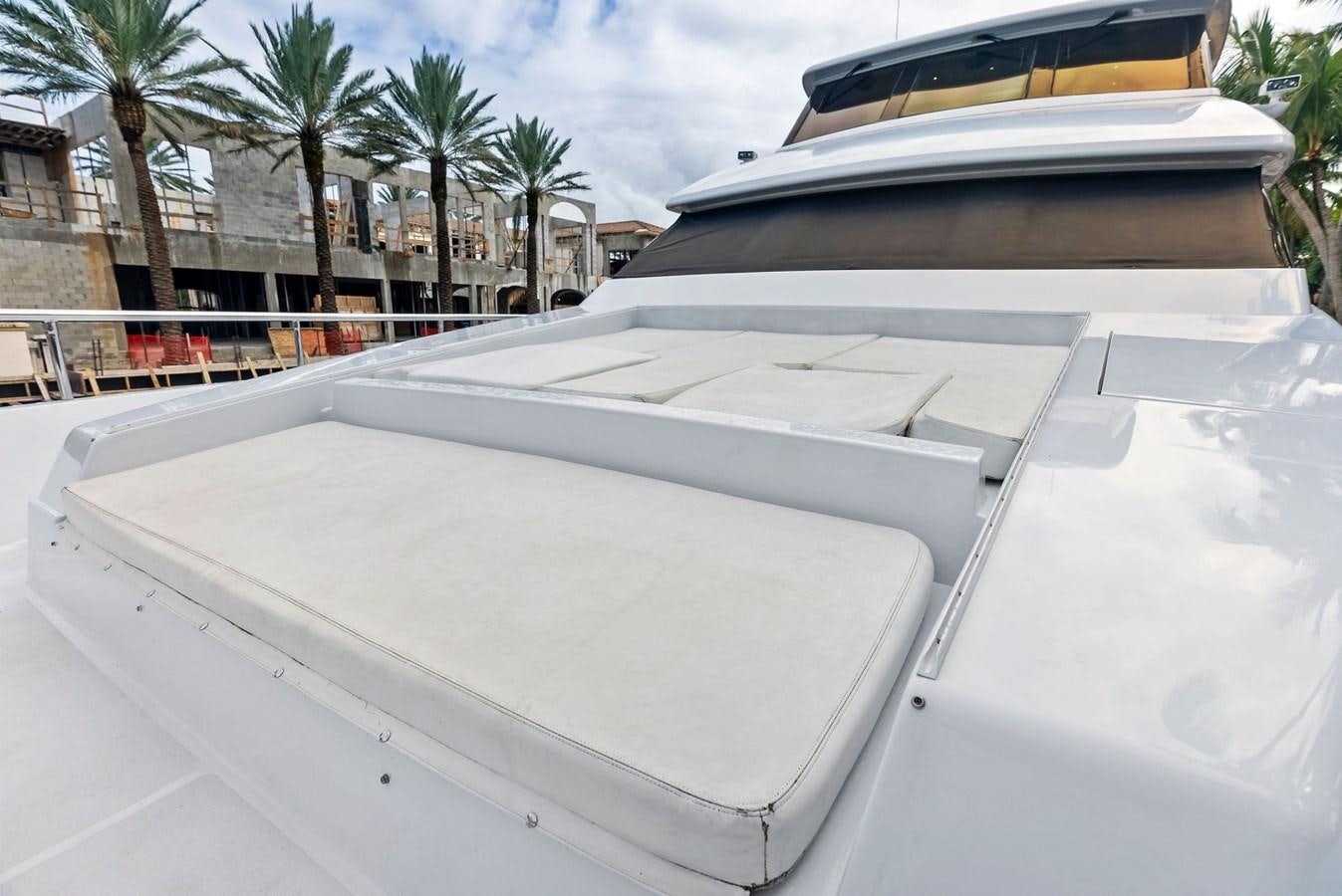 a white car with a roof aboard TORTUGA Yacht for Sale