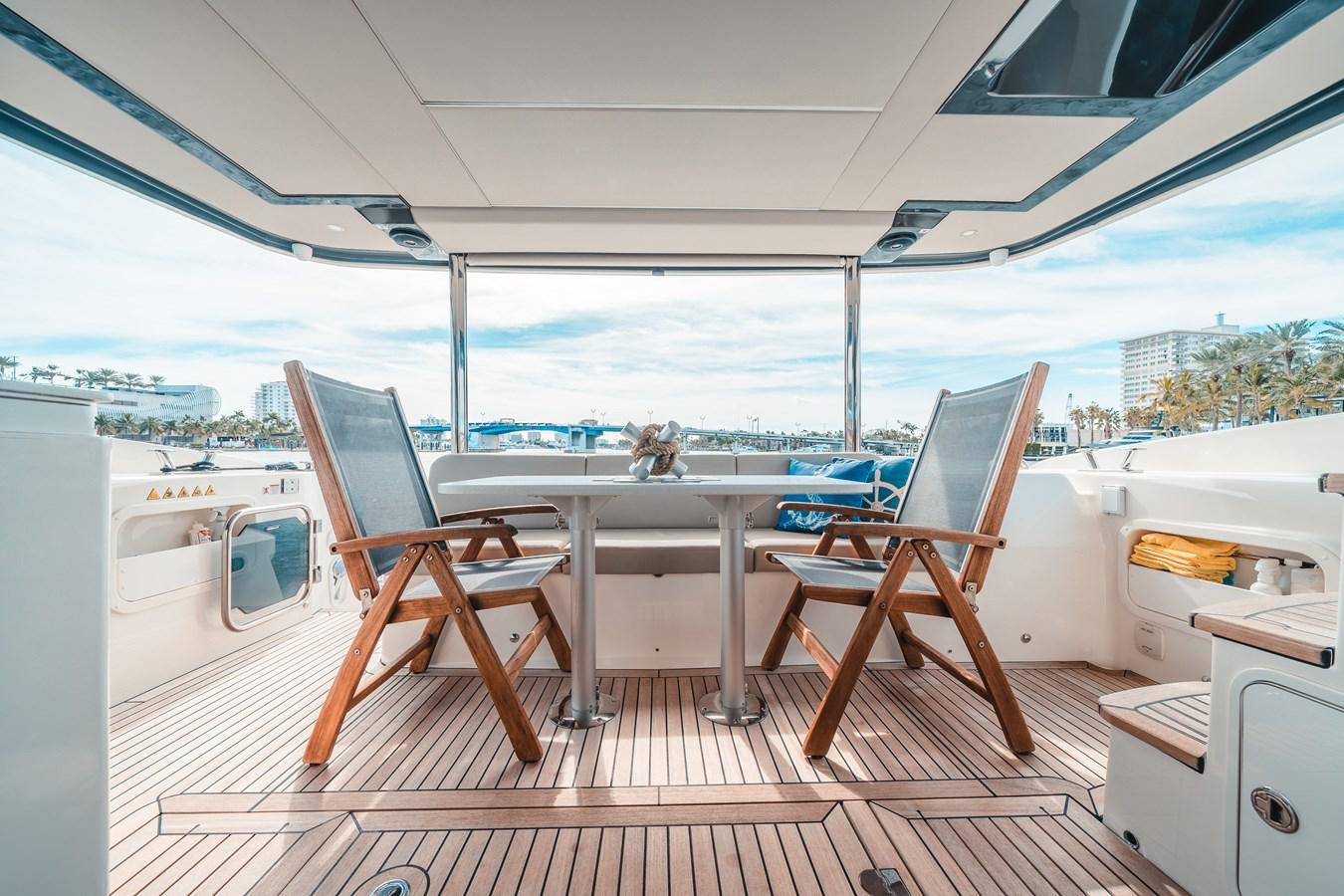 a room with a table and chairs aboard ABSOLUTE 68 NAVETTA Yacht for Sale