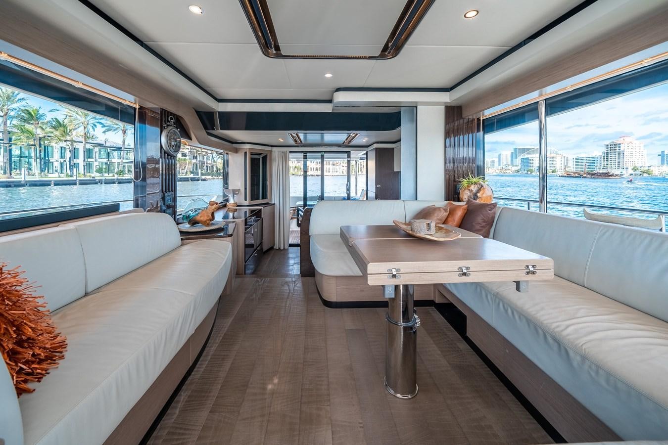 a living room with a large window aboard ABSOLUTE 68 NAVETTA Yacht for Sale