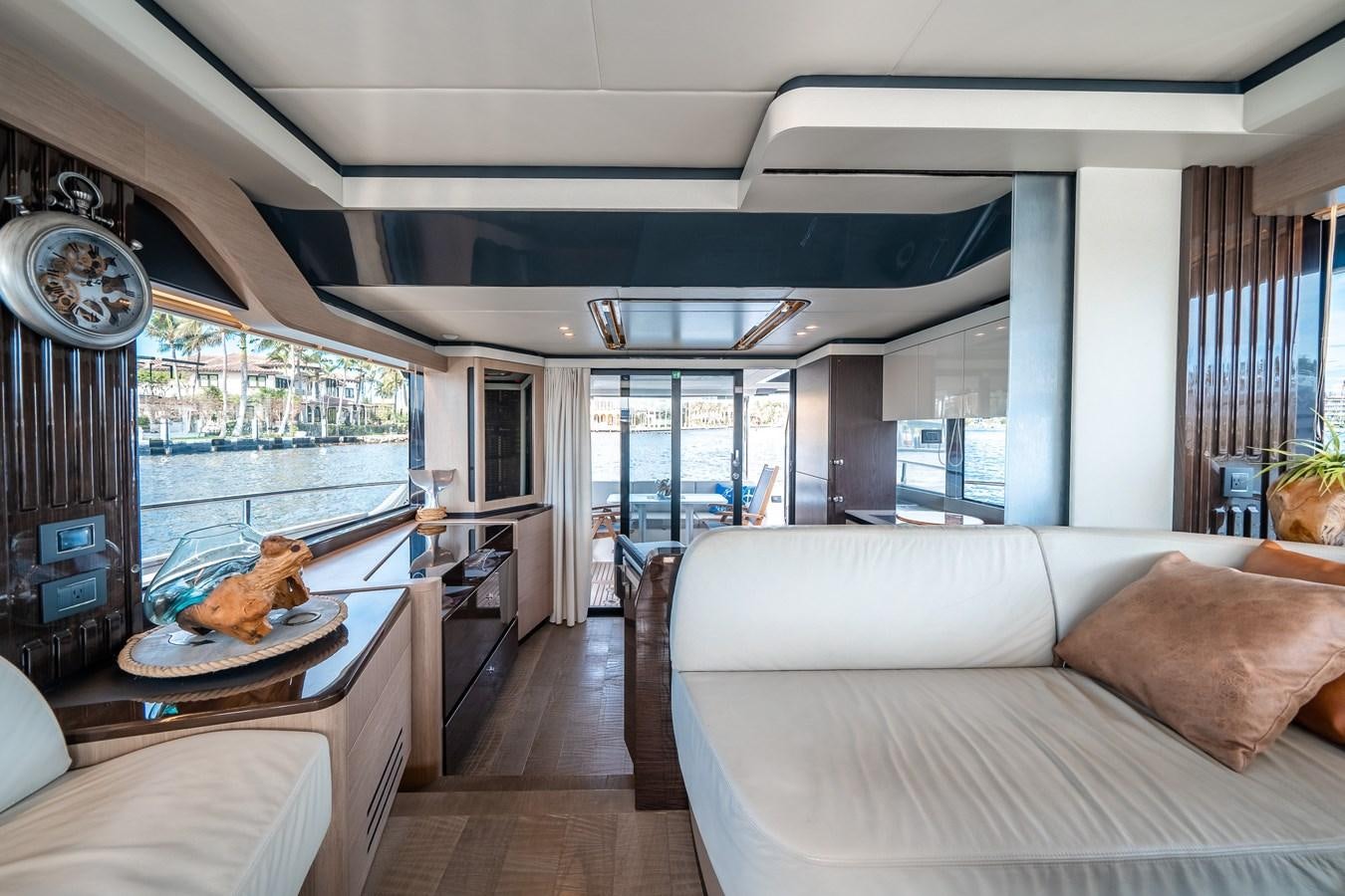 a living room with a large glass window aboard ABSOLUTE 68 NAVETTA Yacht for Sale