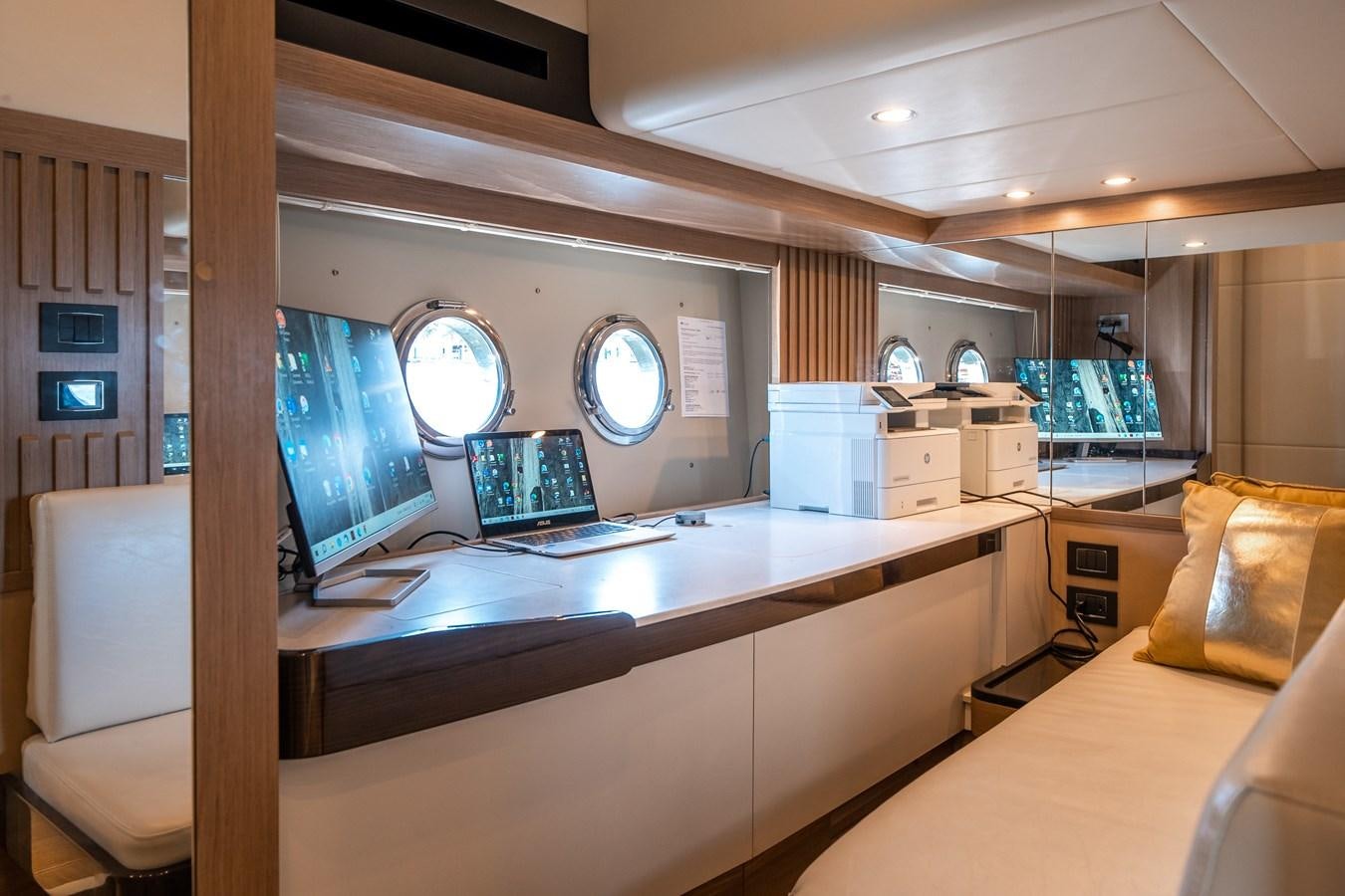 a room with computers and monitors aboard ABSOLUTE 68 NAVETTA Yacht for Sale