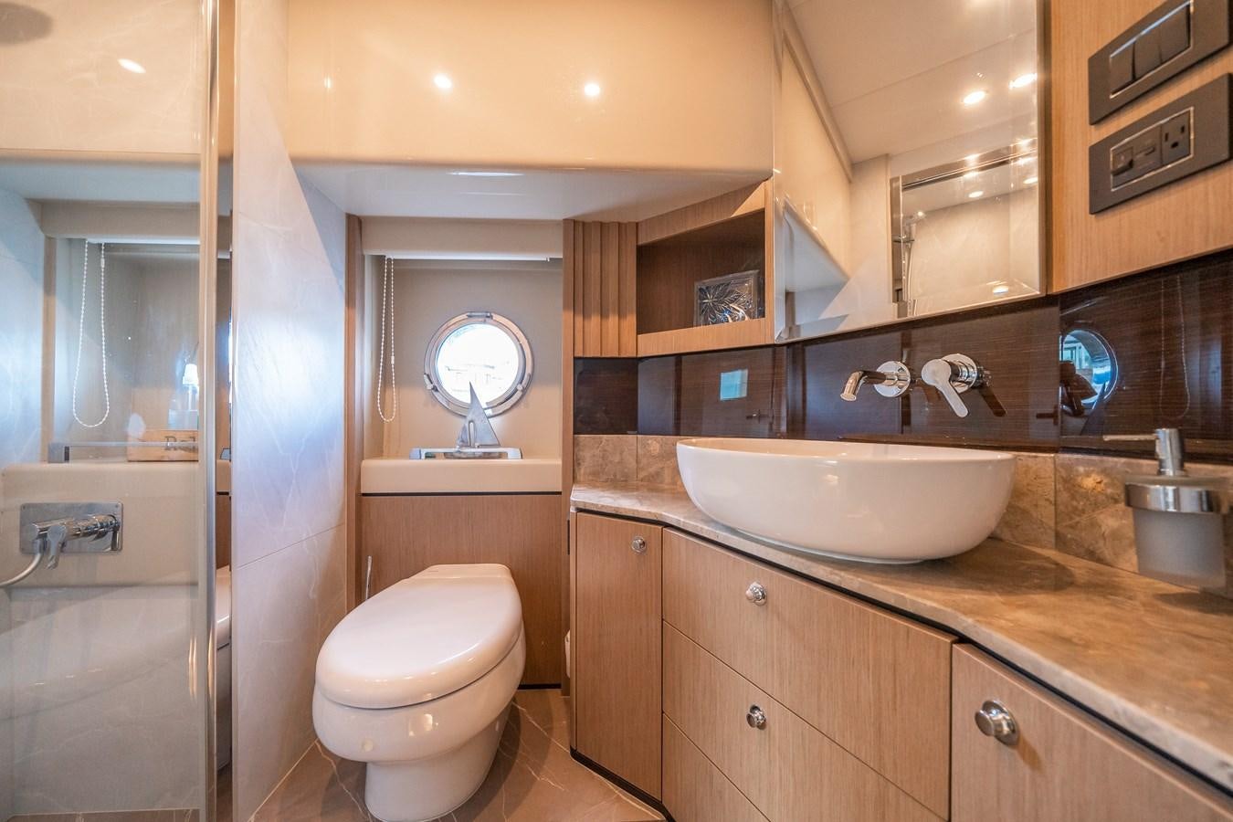 a bathroom with a sink and toilet aboard ABSOLUTE 68 NAVETTA Yacht for Sale