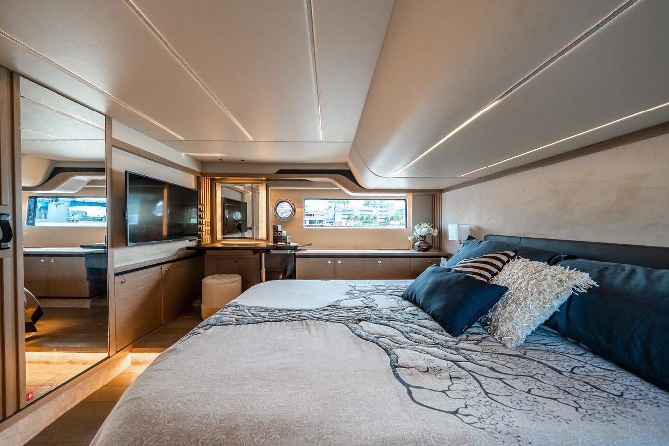 a bedroom with a bed and a television aboard ABSOLUTE 68 NAVETTA Yacht for Sale