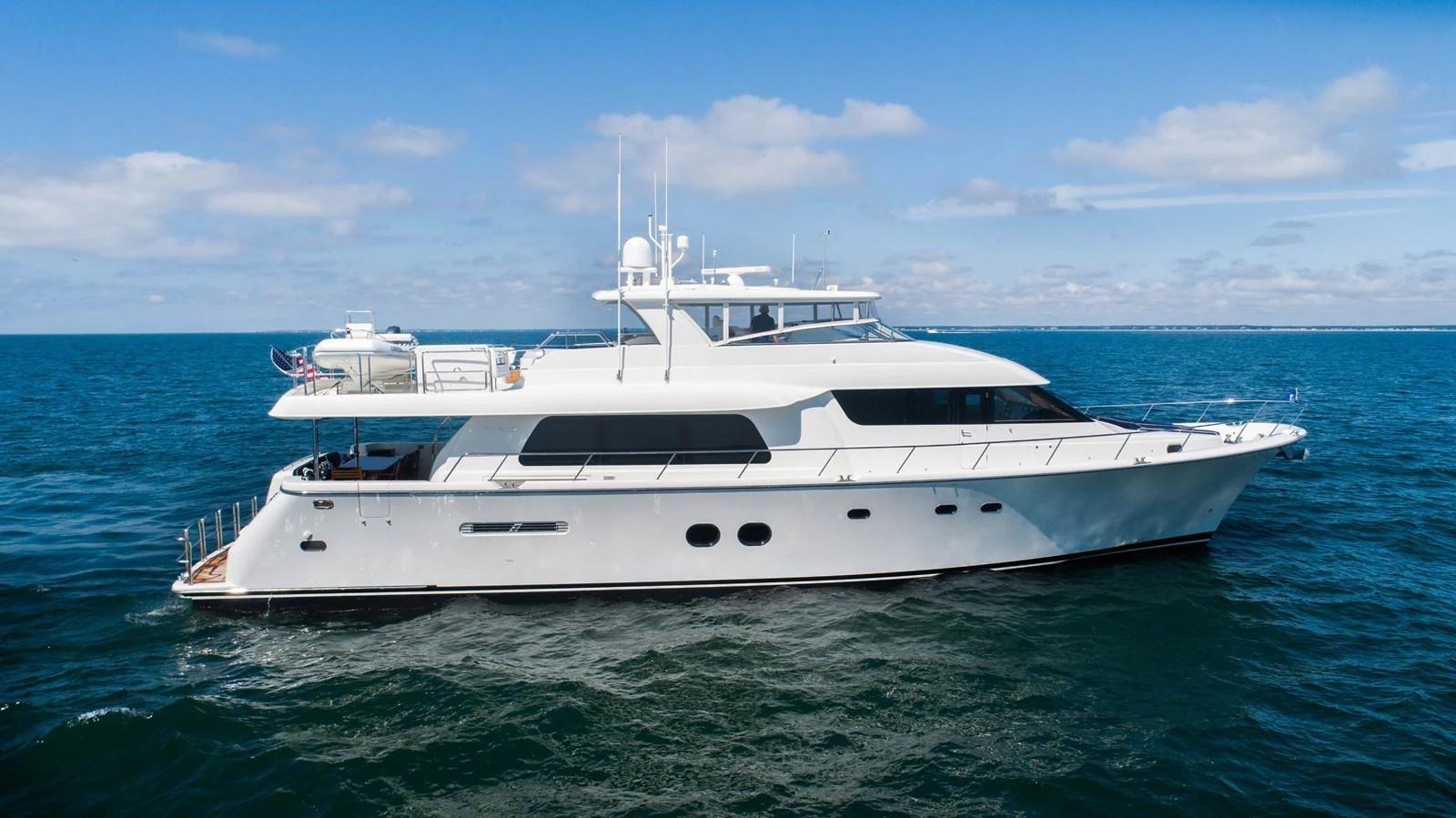 a white yacht in the water aboard TRANQUILITY Yacht for Sale