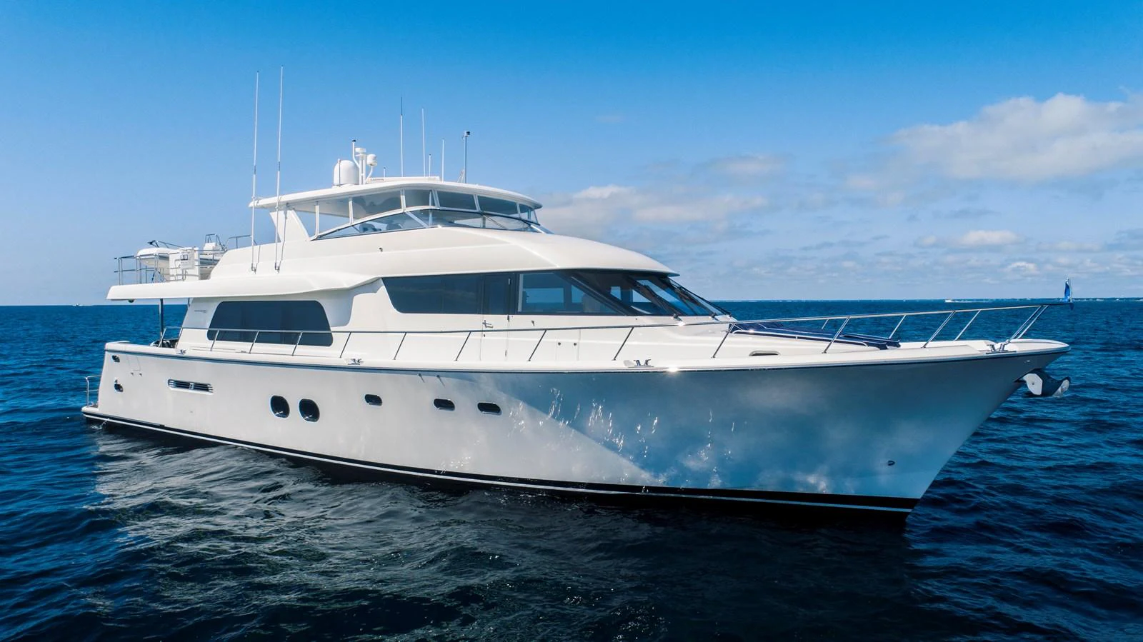 a white yacht in the water aboard TRANQUILITY Yacht for Sale