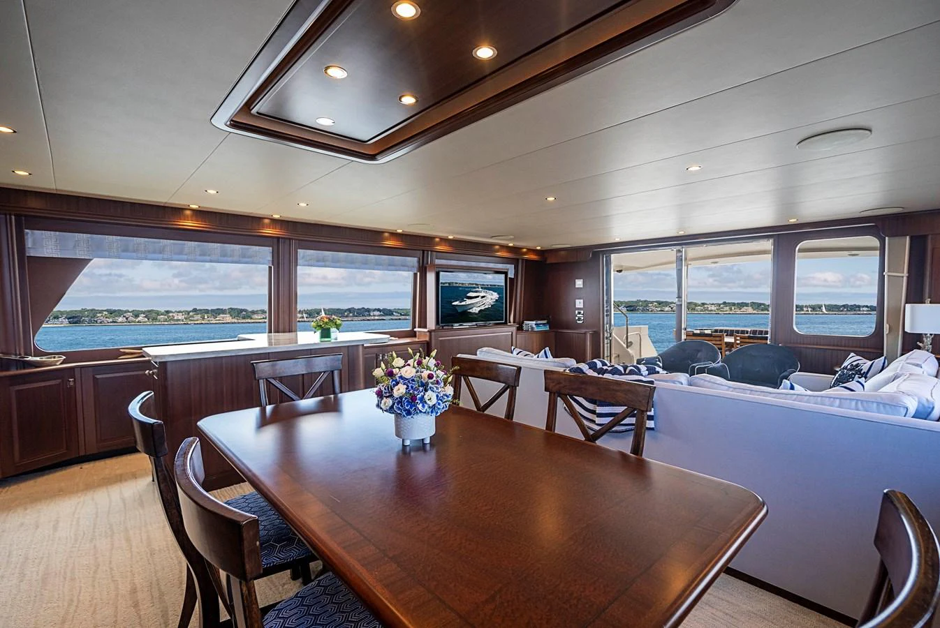 a room with a table and chairs aboard TRANQUILITY Yacht for Sale