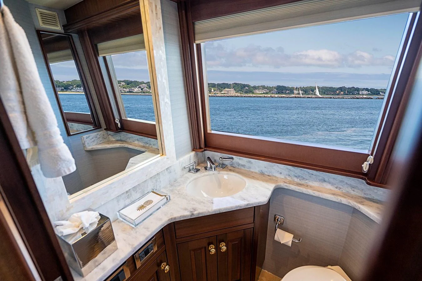 a bathroom with a sink and a window aboard TRANQUILITY Yacht for Sale