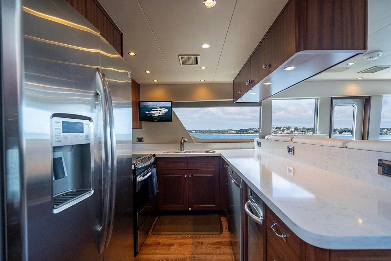 a kitchen with a stainless steel refrigerator aboard TRANQUILITY Yacht for Sale