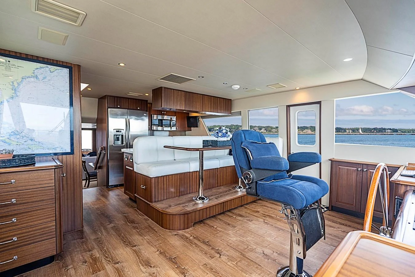 a room with a table chairs and a tv aboard TRANQUILITY Yacht for Sale