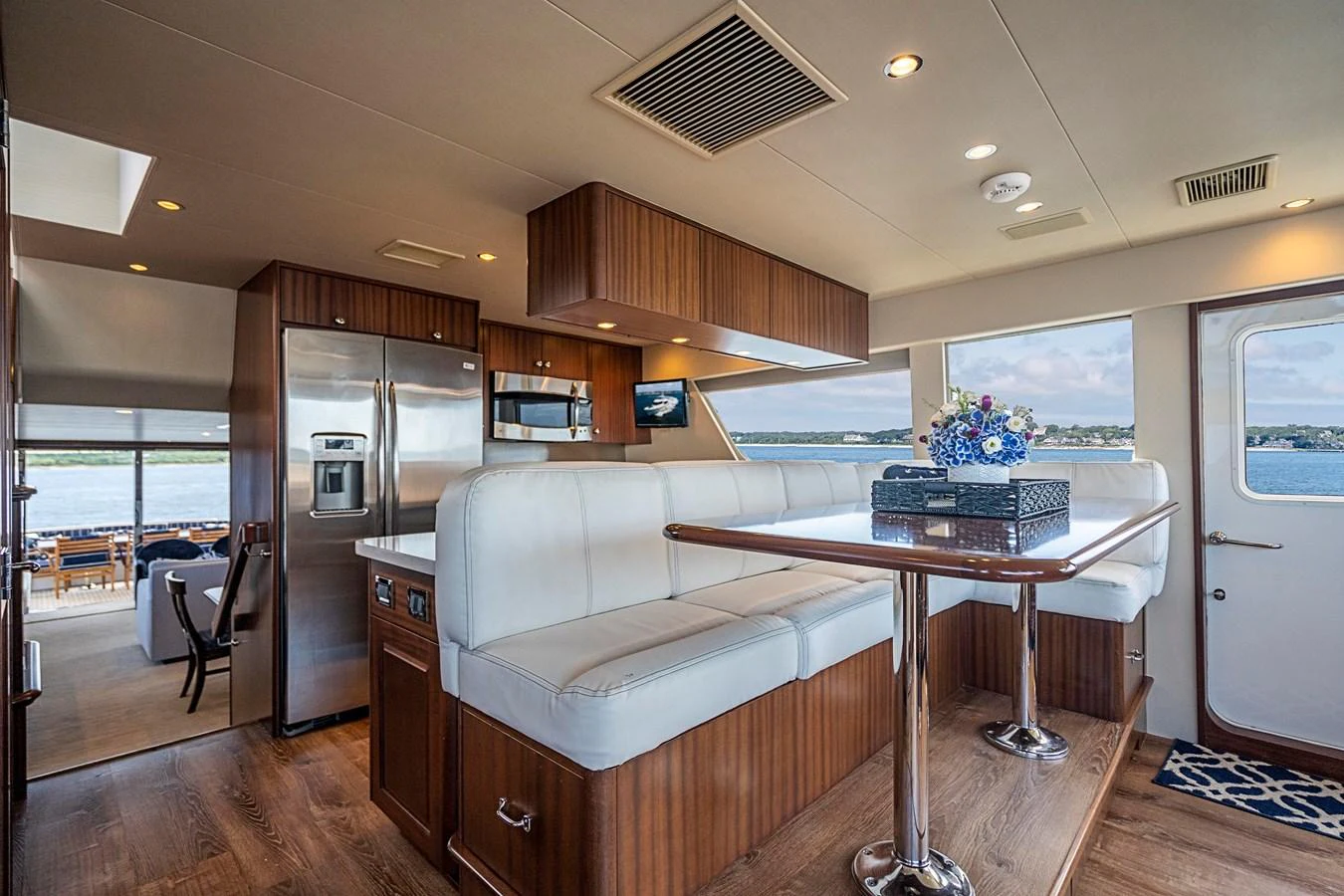 a living room with a couch and a table aboard TRANQUILITY Yacht for Sale