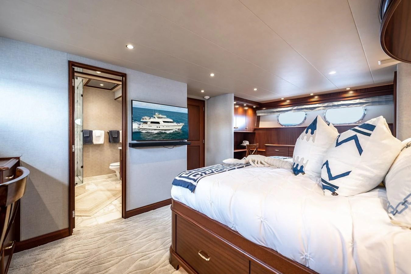 a bedroom with a large bed aboard TRANQUILITY Yacht for Sale