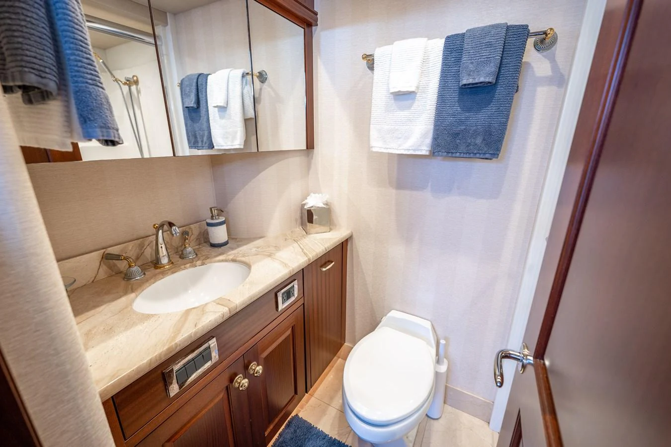 a bathroom with a sink and a toilet aboard TRANQUILITY Yacht for Sale