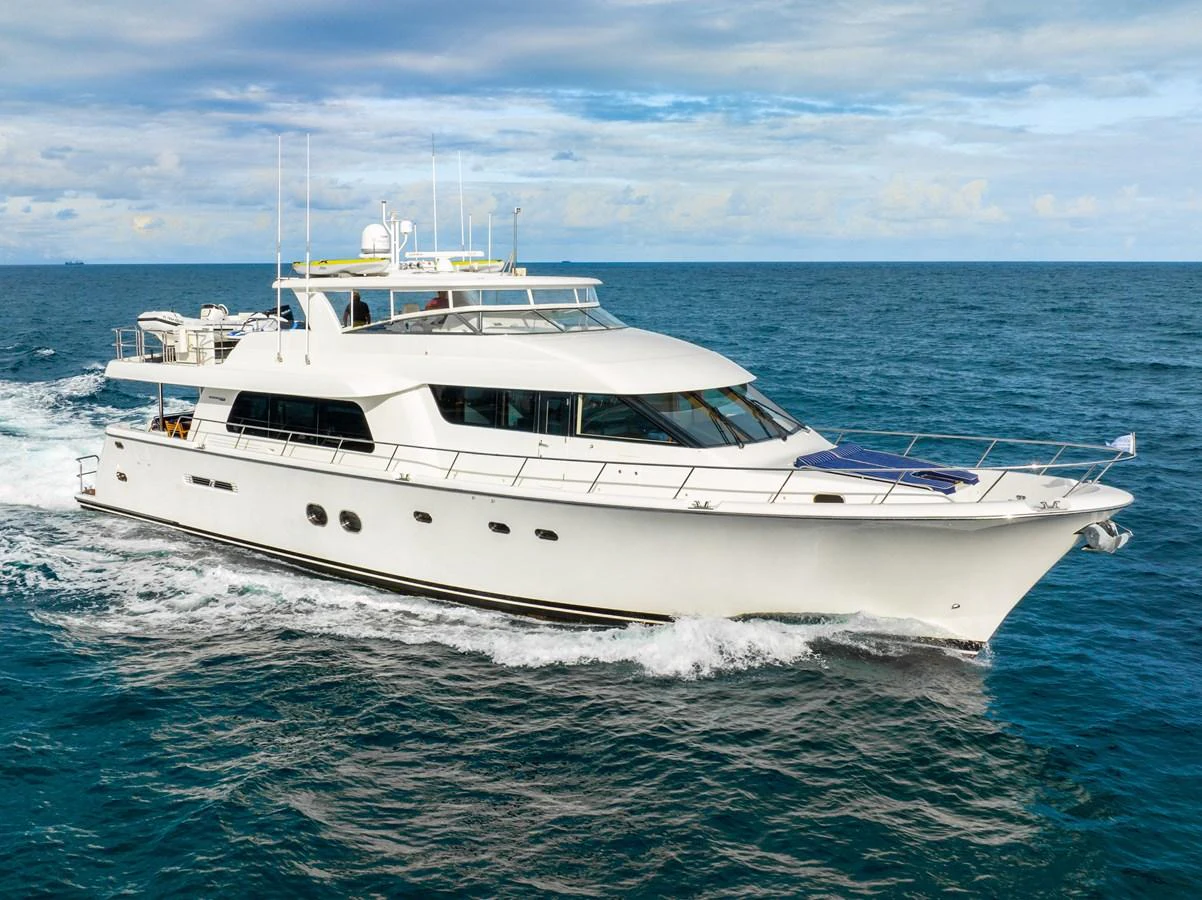 a white yacht on the water aboard TRANQUILITY Yacht for Sale