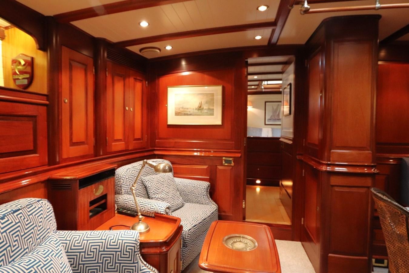 a living room with a leather couch aboard BRAVEHEART OF SARK Yacht for Sale