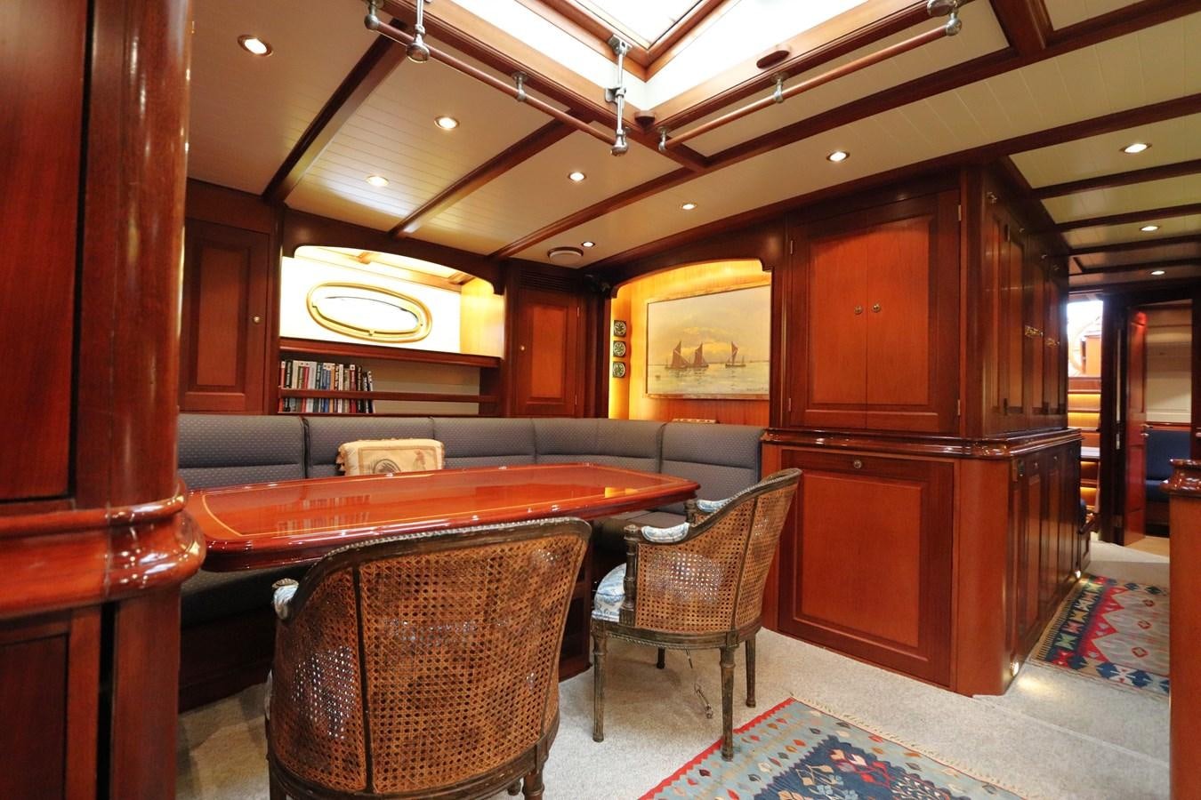 a room with a table and chairs aboard BRAVEHEART OF SARK Yacht for Sale