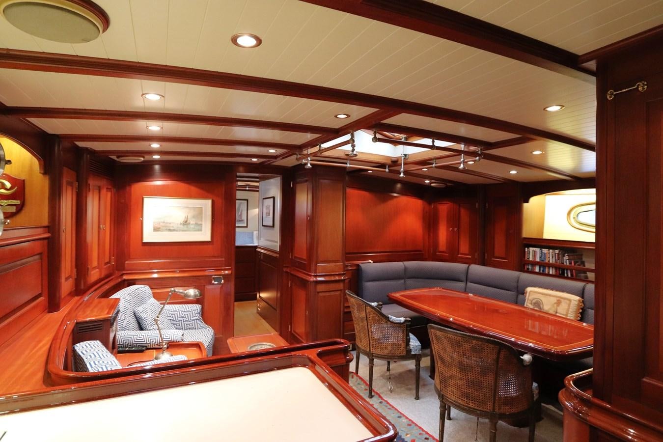 a room with a table and chairs aboard BRAVEHEART OF SARK Yacht for Sale