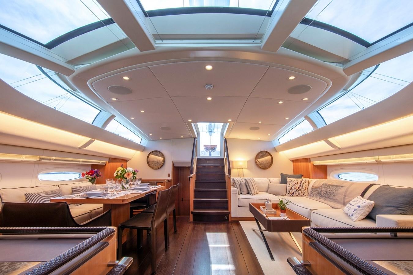 a large living room with a staircase aboard MINI Y Yacht for Sale