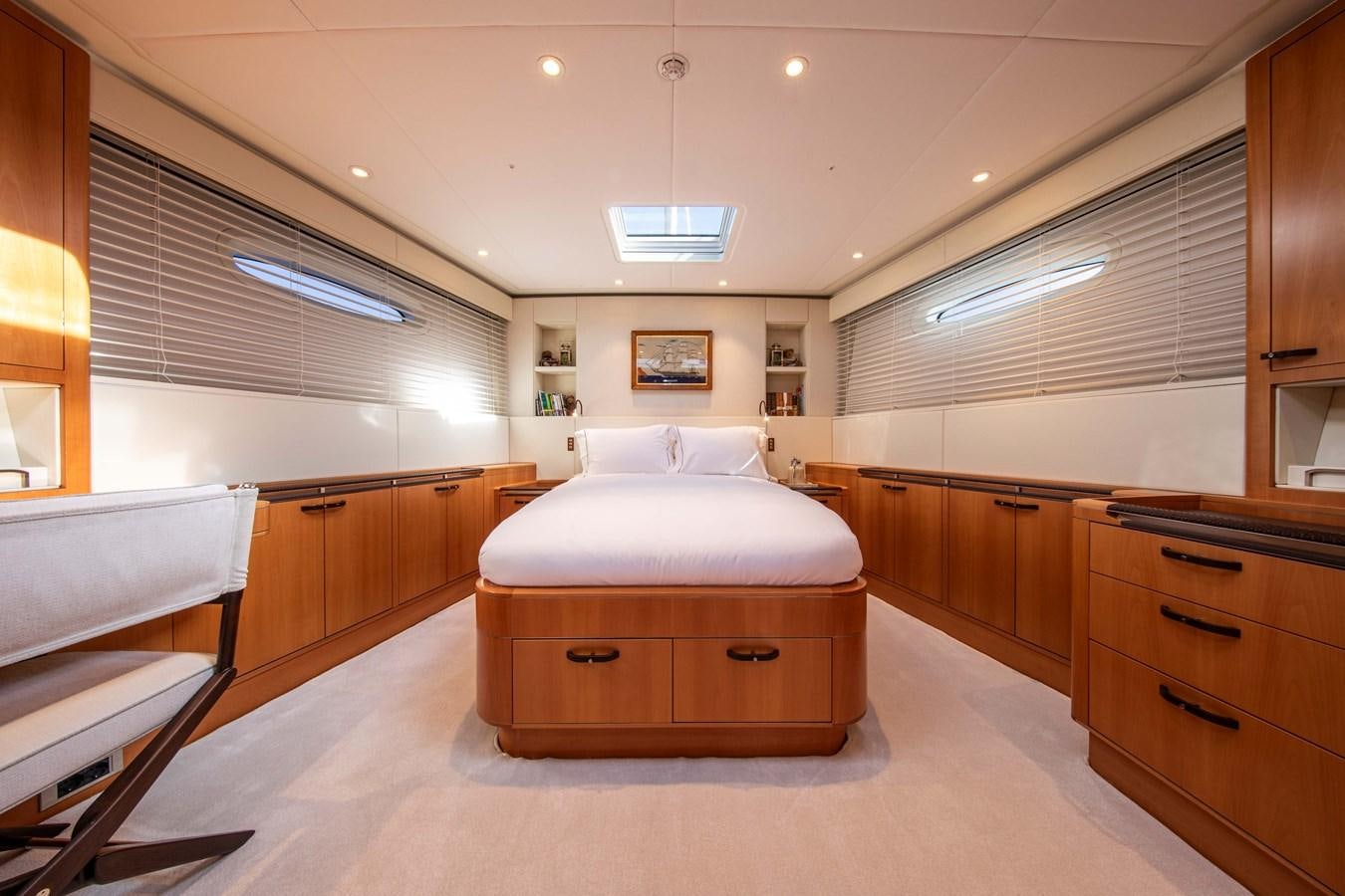 a room with a bed and a desk aboard MINI Y Yacht for Sale