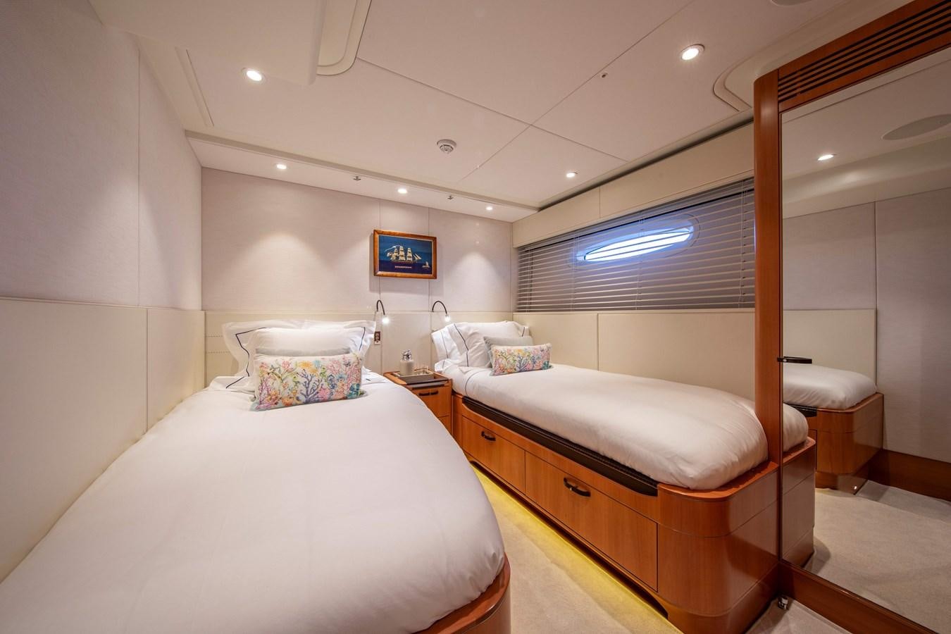a room with two beds aboard MINI Y Yacht for Sale