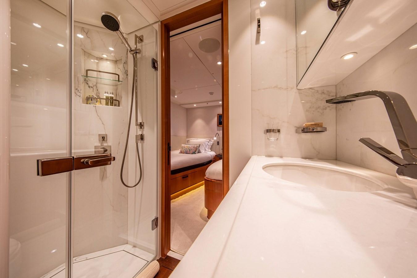 a bathroom with a tub and shower aboard MINI Y Yacht for Sale