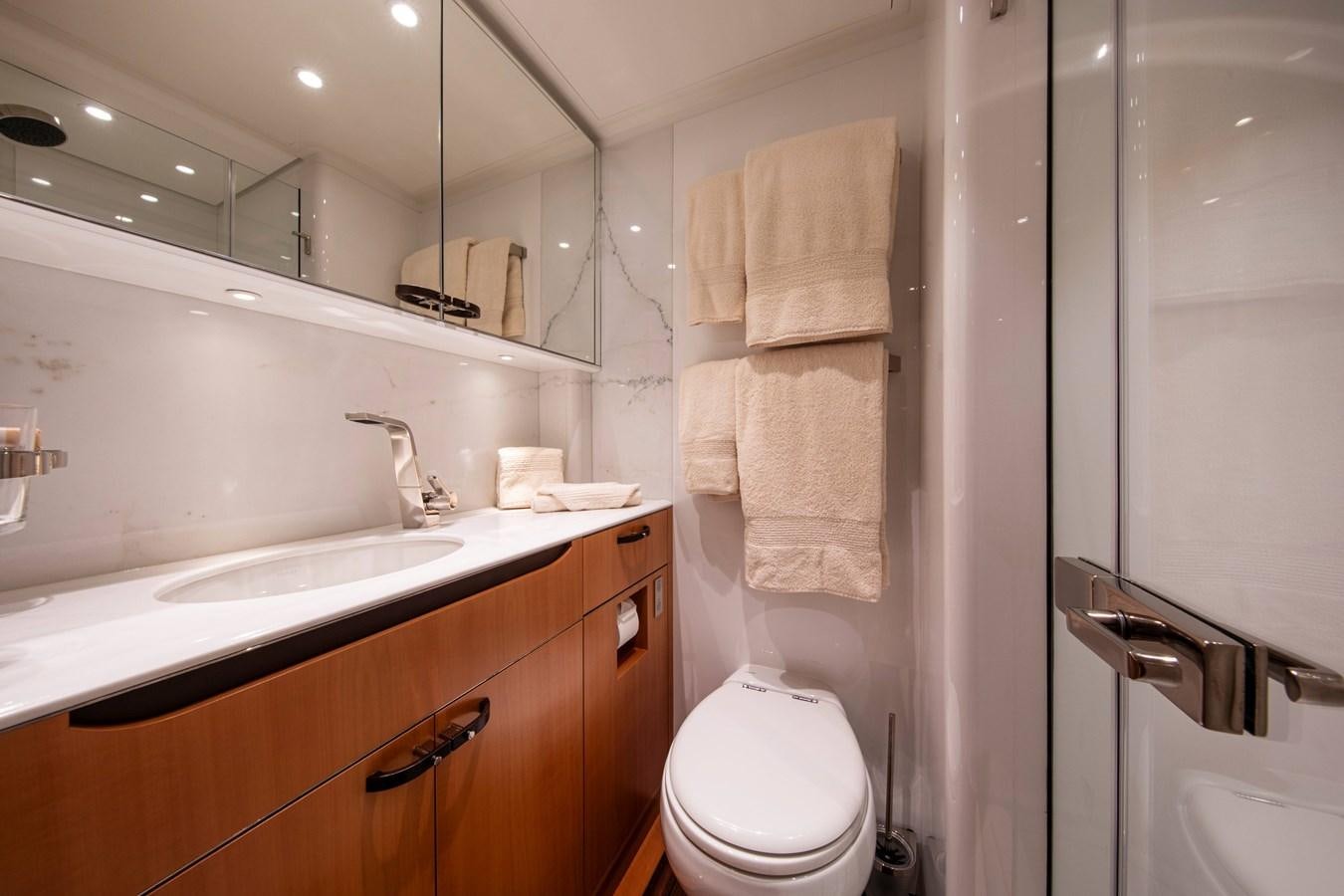 a bathroom with a sink and toilet aboard MINI Y Yacht for Sale