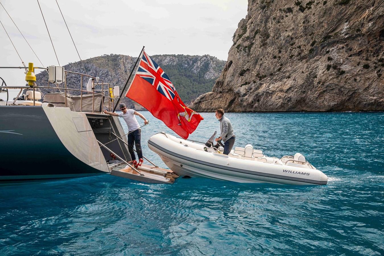 a couple of men on a boat aboard MINI Y Yacht for Sale